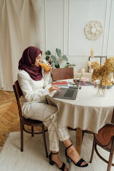 Woman in hijab sitting at laptop